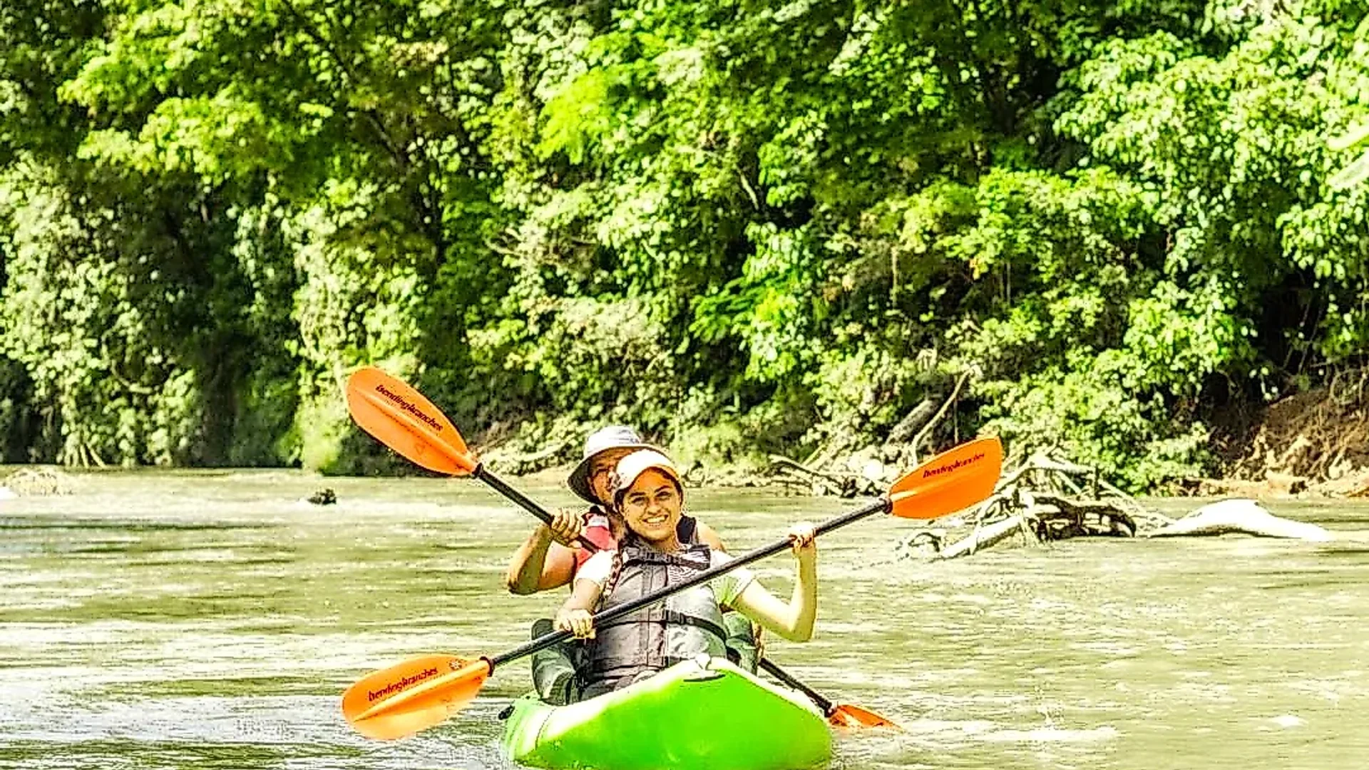 Couple enjoying a kayak tour on the Peñas Blancas River in La Fortuna, Costa Rica.