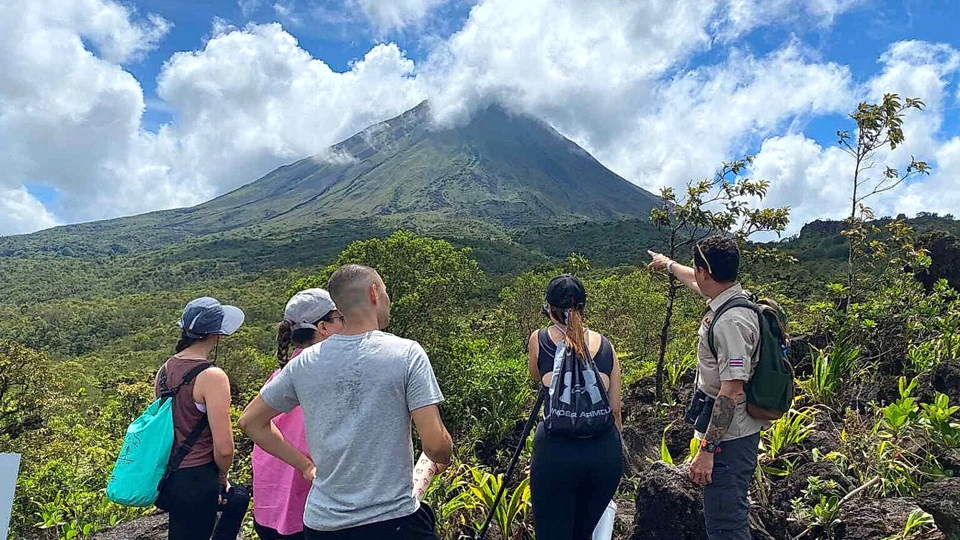 Guided hike through the volcanic lava trails with the majestic Arenal in the background.